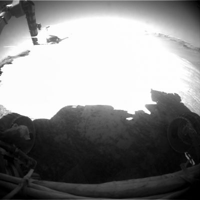 A very bright "flash" in front of Opportunity? Sol 961
Quello che si vede in questo (apparentemente insignificante) frame è un effetto fotografico tipico dell'immagine sovraesposta. 
E che cosa c'è di strano, Vi domanderete, in una immagine sovraesposta? In questo caso è l'image-artifact da sovraesposizione che ci lascia perplessi: esso è il tipico "effetto goccia" il quale - quasi sempre - evidenzia il riflesso del Sole su una superficie cristallina o metallica.

Le ipotesi sono, ovviamente, solo due: 
1) si tratta di un image-artifact sui generis, ma sempre e solo un image-artifact (e cioè un difetto dell'immagine e nulla di più);
2) i raggi del Sole hanno colpito qualcosa che si trovava, nell'istante dello scatto, proprio davanti al Rover: un qualcosa di così lucido e brillante da essere stato capace di "accecare", per un istante, sia la Left, sia la Right Front HazCam di Opportunity.

Ora decidete Voi...

Caption NASA:"Left Front HazCam Non-linearized Full frame EDR acquired on Sol 961 of Opportunity's mission to Meridiani Planum at approx. 13:07:31 MLT".
Parole chiave: Controversial Frame
