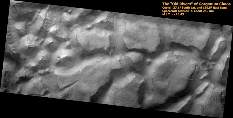 Gorgonum Chaos (Original NASA/JPL/University of Arizona b/w Frame)
PSP_001948_1425 shows part of Gorgonum Chaos, a large cluster of chaotic terrain found in the Southern Hemisphere. 
Many regions of chaotic terrain are found at the head of large outflow channels that were scoured by ancient floods. Gorgonum Chaos is one region that is not associated with an outflow channel. Chaotic terrain can form when subsurface volatiles (such as water) are catastrophically released and the overlying surface collapses. It is not known whether isolated chaotic terrain — such as that shown in this image — formed in the same way that the chaotic terrain near the outflow channels did. Wind erosion might play a role in their formation.

Gorgonum Chaos is an especially interesting area because gullies thought to have been eroded by liquid water are located on its mesas. The gullies have a wide range of orientations and many appear to emanate from a distinct layer in the mesas.

It is not known why gullies form on one slope rather than another, but insolation (amount of sunlight received), availability of water, and regional slope are possible contributing factors. 

Parole chiave: Mars from orbit - Gorgonum Chaos Region
