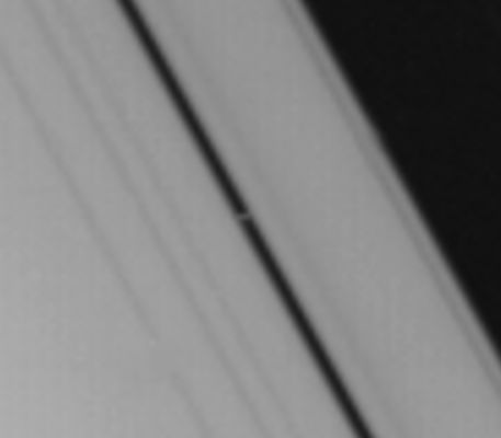 Pan from Voyager 1
Il "Flautista" Pan: una Luna Minore e, nel contempo, uno dei Ring-Master di Saturno. Difficilissimo da vedere ma non per questo meno affascinante. 
Provate ad immaginarVi, per esempio, a ciò che potreste vedere alzando gli occhi se Vi trovaste a "passeggiare" - anche solo per pochi istanti, su questo piccolo mondo di pietra...
Parole chiave: Saturn's Moons - Pan - & Rings