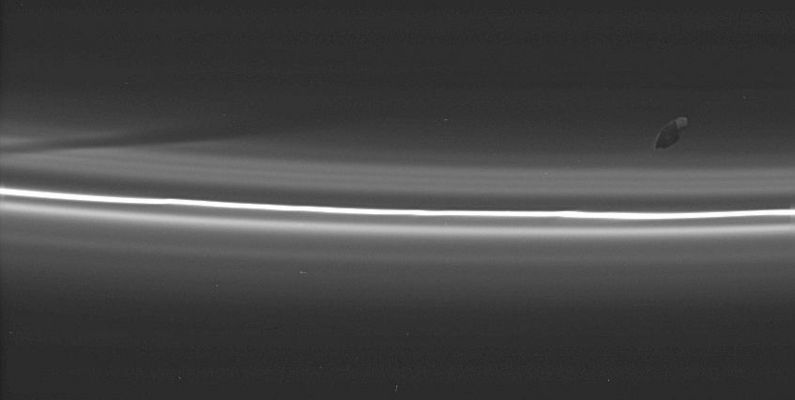 Prometheus leaves a "dark track" inside the F-Ring
Original caption:"Prometheus poses here with its latest creation: a dark, diagonal gore (---> incisione/striscia) in the tenuous material interior to Saturn's F-Ring. The shepherd moon creates a new gore each time it comes closest to the F-Ring while the memory of previous passes is preserved in the Rings' structure for some time afterward. The image was taken in visible light with the Cassini spacecraft narrow-angle camera on Aug. 20, 2005, at a distance of approx. 499.000 Km (about 310.000 miles) from Saturn and at a very high phase angle, such as 144°. 
Resolution in the original image was 3 Km about 2 miles) per pixel".
Parole chiave: Saturn's Moons - Prometheus