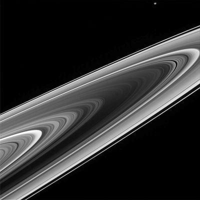 Prometheus and the Rings
Caption NASA originale:"What do Saturn's Rings look like from the other side? From Earth, we usually see Saturn's Rings from the same side of the ring-plane that the Sun illuminates them. Geometrically, in the above picture taken in April by the Cassini Spacecraft, the Sun is behind the camera but on the other side of the ring-plane. Such a vantage point gives a breathtaking views of the most splendid ring system in the Solar System. Strangely, the Rings have similarities to a photographic negative of a front view. For example, the dark band in the middle is actually the normally bright B-Ring. The Ring brightness as recorded from different angles indicates ring thickness and particle density of ring particles. Images like these are also interesting for what they do not show: such as the spokes. The unexpected shadowy regions once recorded by the Voyager missions when they passed Saturn in the early '80s are not, so far, being seen by Cassini. Extra credit: Can you spot the small moon (Prometheus)?
Parole chiave: Saturn's Rings and Prometheus