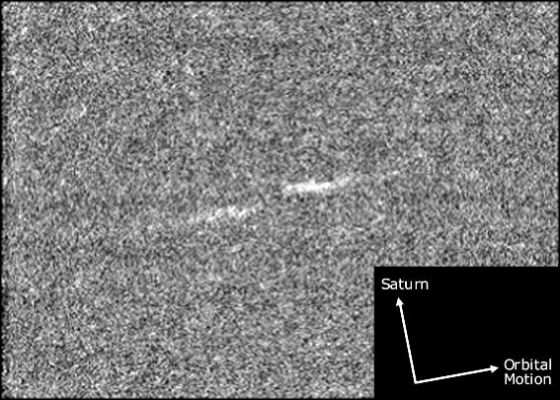 The "Propellers" of the Rings (4) - HR (detail mgnf)
This magnified view illustrates the general orientation of the Propellers in Saturn's Rings, as they orbit around the Planet. 

The two dashes of the Propeller are oriented in the direction of orbital motion. The "leading" dash is also slightly closer to Saturn; this "radial offset" is about 300 mt (about 1000 feet). The unseen moonlet lies in the center of the structure. 

The grainy appearance of the image is due to magnification and the fact that the Propellers are very faint - just visible above the level of the back-ground noise. Consequently, the image enhancement procedures used to create this detail mgnf, have also enhanced the noise.
Parole chiave: Saturn's Rings - The Propellers