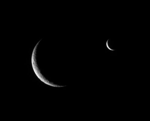 Crescent Moons...
Caption NASA originale:"Rhea and Enceladus shared the sky just before the smaller moon passed behind its larger, cratered sibling. 

This image is part of a "mutual event" series in which one moon passes close to or in front of another. These sequences help scientists refine the orbits of Saturn's moons. 

Cratered Rhea is 1.528 Km (about 949 miles) across and presumed to be geologically dead. While much smaller, Enceladus (505 Km, or about 314 miles across) is geologically active today. 

The image was taken in visible light with the Cassini spacecraft narrow-angle camera on July 4, 2006 at a distance of approx. 1,4 MKM (such as about 800.000 miles) from Rhea and 1,9 MKM (such as about 1,2 MMs) from Enceladus. The view was obtained at a Sun-moon-spacecraft, or phase, angle of about 142°, relative to both moons. 
Image scale is 8 roughly Km (about 5 miles) per pixel on Rhea and roughly 11 Km (about 7 miles) on Enceladus".
Parole chiave: Saturn's Moons - Rhea and Enceladus