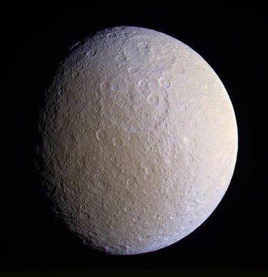 Rhea (enhanced but real colors) from about 341.000 Km
Original caption:"This close view of Rhea prominently shows two large impact basins on the ancient and battered moon. The great age of these basins is suggested by the large number of smaller craters that are overprinted within them. 
Terrain visible in this view is on the side of Rhea that faces away from Saturn. North on Rhea is up and tilted 30° to the left. This enhanced color view was created by combining images taken using filters sensitive to ultraviolet, visible green and infrared light. 
The images were taken with the Cassini spacecraft narrow-angle camera on Dec. 23, 2005, at a distance of approximately 341.000 Km (approx. 212.000 miles) from Saturn and at a Sun-Saturn-spacecraft, or phase, angle of 42°. The image scale is approx. 2 Km (a little more than 1 mile) per pixel". 
Parole chiave: Saturn's Moons - Rhea