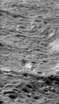 Craters, Slopes and Scarps on Rhea (HR)
Craters within craters cover the scarred face of Saturn's moon Rhea in this oblique, HR view of terrain on the moon's Western Hemisphere. 
A large, degraded crater lies at the center, filled with rolling mounds and many smaller craters. A couple of linear depressions are visible in the terrain (especially at lower right), possibly marking tectonic faults. The crater is about 90 Km-wide (about 56-miles) and is located at 8,5° South Latitude and 154,9 West Longitude. The moon's icy regolith, or loose surface material, has likely been pummeled into a fine powder over the eons. 
This is one of the highest-resolution images of Rhea's surface obtained during Cassini's close flyby on Nov. 26, 2005, during which the spacecraft swooped to within 500 Km of the large moon. 
The clear filter image was acquired with the wide-angle camera at an altitude of approx. 620 Km above Rhea. 
Image scale is about 85 mt (approx. 280 feet) per pixel.
Parole chiave: Saturn's Moons - Rhea