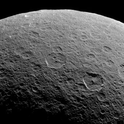 Old Rhea...
Caption NASA originale:"Cassini looks down upon Rhea, whose cratered surface was already ancient before any complex life developed on Earth. The terrain seen here has probably changed little in the past billion years (!). This view shows terrain on the Saturn-facing Hemisphere of Rhea. North is up. 

The image was taken in visible light with the Cassini spacecraft narrow-angle camera on March 21, 2006 at a distance of approximately 94.000 Km (such as about 59.000 miles) from Rhea and at a phase angle of 109°. The image scale is about 558 mt (approx. 1.832 feet) per pixel".
Parole chiave: Saturn's Moons - Rhea