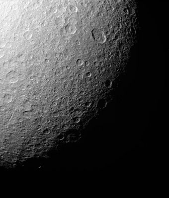 Rhea, from about 239.000 Km
Original caption:"Like the rest of Rhea's surface, the Southern Polar Region of this Saturn moon has been extensively re-worked by cratering over the eons. This close-up shows that most sizeable craters have smaller, younger impact sites within them. Near the left lies an intriguing gash (---> taglio lungo e profondo, ivi sinonimo di "chasm" o "cleft"). 
The largest well-defined crater visible here is an oval-shaped impact toward the upper right. The crater is 115 by 91 Km (such as 71 by 57 miles) in size. Cassini acquired this view during a distant flyby of Rhea on July 14, 2005. 
The image was taken in visible light with the Cassini spacecraft narrow-angle camera at a distance of approx. 239.000 Km (such as 149.000 miles) from Rhea and at a Sun-Rhea-spacecraft angle of 56°. The image was obtained using a filter sensitive to wavelengths of infrared light centered at 930 nnmts. The image scale is about 1 Km per pixel".
Parole chiave: Saturn's Moons - Rhea