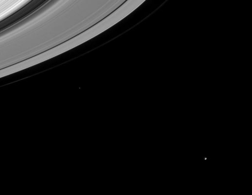 Rings and Moons (detail - x4 mgnf)
Caption NASA originale:"This image captures several important targets of the Cassini mission: icy moons, rings and the gaps in the rings that may contain small undiscovered moons. Mimas (398 Km across) is easily seen near lower right. Epimetheus (116 Km across) is visible left of center. The 4.800 Km wide Cassini division is the dark swath at upper left. The Encke Gap (325 Km wide) is visible as a dark curve near the edge of the A-Ring. The thin F-Ring is seen here, exterior to the main rings.
The image was taken in visible light with the Cassini spacecraft narrow angle camera on Sept. 10, 2004, at a distance of 8.9 MKm(5.5 million miles) from Mimas and at a Sun-Mimas-spacecraft (or "phase") angle of 84°. The image scale is 53 Km per pixel. 
The image was magnified by a factor of four to aid visibility". 
Parole chiave: Rings and Moons