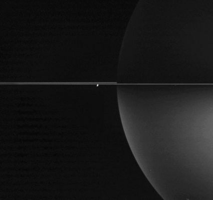 Crescent Enceladus and Crescent Rings
Sunlight reflects off the bright, frozen surfaces of the billions and billions of particles comprising Saturn's Rings to brighten the Planet's Southern Skies. 
The particles in Saturn's Rings are each too small to be seen by Cassini in this image but, if they could, each would look like the bright reflective crescent of Enceladus seen here, with each reflecting sunlight onto the Southern Hemisphere of the Planet. 

The image was taken in polarized infrared light with Cassini's wide-angle camera on Nov. 2, 2005, at a distance of approx. 1,7 MKM (1,1 MMs) from Saturn and at a phase angle of 119°. The image scale is roughly 104 Km (about 65 miles) per pixel.
Parole chiave: Saturn's Rings and Enceladus