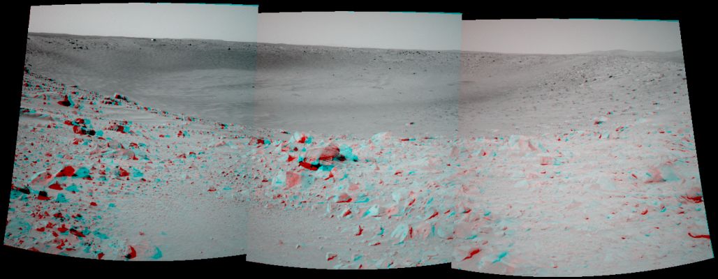 Bonneville Crater's Panorama (3D) - Sol 68
Caption NASA originale:"The MER Spirit took this 3-D NavCam mosaic Of the crater called "Bonneville" after driving approximately 13 mt (such as approx. 42,7 feet) to get a better vantage point. Spirit's current position is close enough to the edge to see the interior of the Crater, but high enough and far enough back to get a view of all of the walls. Because scientists and rover controllers are so pleased with this location, they will stay here for at least two more Soles, to take HR PanCam images of Bonneville in its entirety. Just above the far Crater rim, on the left side, is the Rover's Heat-Shield, which is visible as a tiny reflective speck".
Parole chiave: Mars craters - Bonneville Crater