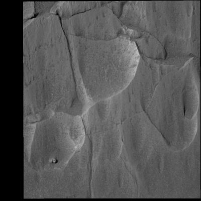 "Peeling" Mazatzal - Sol 77
Caption NASA originale:"Mazatzal, like most rocks on Earth and Mars, has layers of material near its surface that provide clues about the history of the rock. Scientists believe that the top layer of Mazatzal is actually a coating of dust and possibly even salts. Under this light coating may be a more solid portion of the rock that has been chemically altered by weathering. Past this layer is the unaltered rock, which may give scientists the best information about how Mazatzal was formed. Because each layer reveals information about the formation and subsequent history of Mazatzal, it is important that scientists get a look at each of them. For this reason, they have developed a multi-part strategy to use the RAT to systematically peel back Mazatzal's layers and analyze what's underneath with the Rover's MI, and its Moessbauer and APXS. The strategy began on sol 77 when scientists used the microscopic imager to get a closer look at targets on Mazatzal named "New York," "Illinois" and "Arizona." These rock areas were targeted because they posed the best opportunity for successfully using the rock abrasion tool; Arizona also allowed for a close-up look at a range of tones. On sol 78, Spirit's rock abrasion tool will do a light brushing on the Illinois target to preserve some of the surface layers. Then, a brushing of the New York target should remove the top coating of any dust and salts and perhaps reveal the chemically altered rock underneath. Finally, on sol 79, the rock abrasion tool will be commanded to grind into the New York target, which will give scientists the best chance of observing Mazatzal's interior".
Parole chiave: Mars rocks, sand and debris
