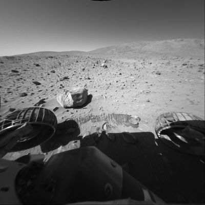 Big Rock - Sol 154
Caption NASA originale:"This image was taken by NASA's MER Spirit's Front Haz-Cam during Spirit's 154th Sol on June 9, 2004. The Columbia Hills appear against the horizon. Directly in front of the Rover is the highest of the hills, Husband Hill, approximately 90 mt (about 295 feet) tall. The rock in the foreground is larger than other surrounding rocks, approximately 35 cm (approx. 14") across, but was not an observation target for Spirit. The tread marks in front of the rock are not a trench, but simply evidence that the Rover passed by as it continued its journey toward the Columbia Hills".
Parole chiave: Mars rocks, sand and debris