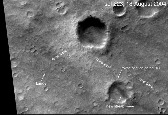 Did you EVER see Missoula Crater?!? - Sol 223
Un frame 'dall'alto' - ossìa proveniente dal Mars Global Surveyor - il quale ci mostra (con notevole chiarezza) il cammino di Spirit sino al Sol 223. Tutto normale? Diremmo proprio di no.
Forse ci stiamo sbagliando clamorosamente (ed infatti Vi chiediamo di darci un aiuto, se potete e se volete...), ma la nostra sensazione è che NON esista un singolo frame che ci mostri il Missoula Crater, accanto al quale (anzi: sul cui 'ciglio') il Rover dovrebbe essere passato lungo il cammino verso le Columbia Hills.
Inoltre dobbiamo sottolineare ancora una volta che sul bordo del Cratere Bonneville si vede (proprio ad ore 12) una striscia scura e spessa dove invece dovrebbe esserci il bianco (l'effetto tipico di un oggetto riflettente) dell'Heat-Shield. 
Non siete convinti? Andate a guardarVi la ripresa MGS di questa stessa area (ottenuta nel Sol 85) con l'aggiunta del punto di caduta di Back-Shell e Paracadute. La Back-Shell è metallica come l'Heat-Shield, ma molto più piccola, eppure si vede benissimo!
Come mai?

Parole chiave: Mars from orbit - Landing Sites