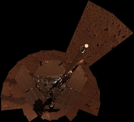 Spirit's "Self-Portrait" - Sol 330 (Approximate True Colors; credits: NASA/JPL-Caltech)
Caption NASA originale:"NASA's Mars Exploration Rover Spirit used its panoramic camera to take the images combined into this mosaic view of the rover. The downward-looking view omits the mast on which the camera is mounted. It shows dust accumulation on Spirit's solar panels. The images were taken through the camera's 600-, 530- and 480-nanometer filters during Spirit's 329th and 330th Martian Days, or Sols". 
Due immagini simili e due "volti" di Marte completamente diversi da tutti i punti di vista: dal colore, alle condizioni atmosferiche generali. Se i pannelli solari di Opportunity, infatti, sono (sia pure solo relativamente, come dicono alla NASA) puliti, quelli di Spirit sembrano ormai completamente ricoperti di polvere. Dunque alla NASA ci stanno "anticipando" che i Soles di Spirit sono "contati"?
Guardate le immagini e decidete Voi...
Parole chiave: Postcards from Mars