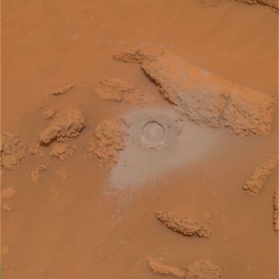 Another hole in the wall... - Sol 381 (Natural Colors; credits: NASA/JPL-Caltech)
Caption NASA originale:"NASA's Mars Exploration Rover Spirit has been analyzing sulfur-rich rocks and surface materials in the "Columbia Hills" in Gusaev Crater on Mars. This image of a very soft, nodular, layered rock nicknamed "Peace" in honor of Martin Luther King Jr. shows a 4.5-cm-wide (1.8-inch-wide) hole Spirit ground into the surface with the rover's rock abrasion tool. The high sulfur content of the rock measured by Spirit's alpha particle X-ray spectrometer and its softness measured by the abrasion tool are probably evidence of past alteration by water. Spirit's panoramic camera took this image on Sol 381 (such as Jan. 27, 2005). The image represents the PanCam team's best current attempt at generating a true color view of what this scene would look like if viewed by a human on Mars. The image was generated from a combination of six calibrated, left-eye PanCam images acquired through filters ranging from 430 to 750-nnmt wavelengths".
Parole chiave: Mars rocks, sand and debris