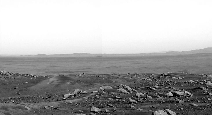 View from the Summit: the rim of Thira Crater and the Eastern Horizon - Sol 582
Original caption:"After 581 Soles and 4810 meters (about 2,99 miles), Spirit reached the crest of Husband Hill.
The top of the hill is moderately flat and fairly easy to navigate. Even though Sol 581 (Aug. 21, 2005) marked a major accomplishment for Spirit, the "little rover that could" had no time to rest. On sol 582, the team commanded the Rover to drive to a better location for taking images in all directions. This spot was about 20 mt (about 66 feet) along the crest, and it was from this location that Spirit started acquiring frames with the PanCam for a 360°, full-color, panorama. 
The panoramic imaging will take about 12 hours to complete. In Mars time this means about four sols. On sols 583, 584 and 585, Spirit will image the martian landscape, and the team will wait until sol 586 to image the rover equipment deck. 
Since Spirit will be in the same location for a while, Spirit placed its robotic arm onto an undisturbed soil target and started a long Mössbauer spectrometer integration on Sol 584".
Parole chiave: Mars Panorama