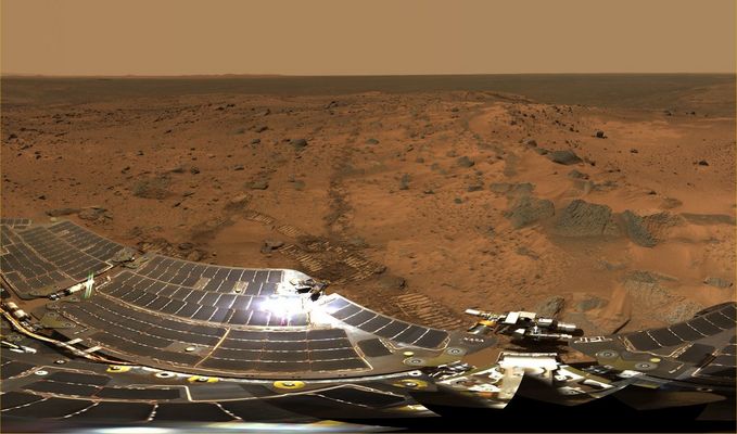 Summit Panorama (2) - Sol 583-586
This panorama provided the team's first view of the Inner Basin Region, including the enigmatic Home Plate feature seen from orbital data. After investigating the Summit, Spirit drove downhill to get to the Inner Basin Region. Spirit arrived at the Summit from the west, along the direction of the Rover tracks seen in the middle right of the panorama. The peaks of "McCool Hill" and "Ramon Hill" can be seen on the horizon near the center of the panorama. The Summit Region itself is a broad, windswept plateau. Spirit spent more than a month exploring the Summit Region, measuring the chemistry and mineralogy of soils and rocky outcrops at the peak of Husband Hill for comparison with similar measurements obtained during the ascent.

Nota: questo panorama è in approx. true colors. Provate a confrontarlo con un altro panorama, sempre in approx. true colors (sic!) e relativo alla Regione di Erebus Crater (cfr. "Olympia Panorama") e poi provate a chiederVi dove sia la verità...
Parole chiave: Mars Panorama - Husband's Hill Summit