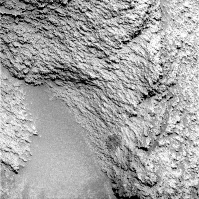 On the way to El Dorado (6) - Sol 704
Original caption:"On sol 703, Microscopic Images were taken of a fin-shaped feature on Comanche.

Sol 704 and 705: Sol 704's activities wrapped up the work on Comanche. Spirit drove toward El Dorado on both Soles 704 and 705 as part of a 3-Sol plan starting on Sol 703. The first driving Sol began with 22 mt (about 72 feet) of directed driving followed by autonomous navigation toward the dune fields. The second driving Sol would not have the benefit of humans in the loop, and so was purely autonomous navigation, picking up on the heels of the previous Sol to get Spirit within striking range of El Dorado. The Team expected to get perhaps 80 to 90 mt (about 263 to 295 feet) from the 2 Soles of driving. However, by the end of Sol 705, Spirit had driven 118 mt (about 387 feet), and was about a 1-Sol drive away from El Dorado".
Parole chiave: Mars rocks, sand and debris