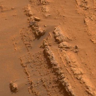 Layers at Home Plate (1 - approximate true colors; credits: NASA) - Sol 749
Caption NASA originale:"This image shows coarse-grained layers from around the edge of a low plateau called Home Plate inside Mars' Gusev Crater. One possible origin is material falling to the ground after being thrown aloft by an explosion such as a volcanic eruption or meteorite impact.

The PanCam on NASA's MER Spirit acquired the exposures for this image on Spirit's 749th Sol (Feb. 10, 2006). This view is an approximately true-color rendering mathematically generated from separate images taken through all of the left Pancam's 432- to 753-nnmt filters".
Parole chiave: Martian Surface - Home Plate layers