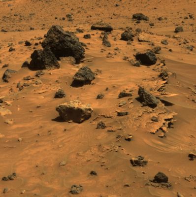 Spirit's Razorblades (1) - Sol 809 (approx. true colors)
Caption NASA originale:"At least 3 different kinds of rocks await scientific analysis at the place where NASA's MER Spirit will likely spend several months of Martian Winter. They are visible in this picture, which the PanCam on Spirit acquired during the Rover's 809th Sol of exploring Mars (such as April, 12, 2006). Paper-thin layers of light-toned, jagged-edged rocks protrude horizontally from beneath small sand drifts; a light gray rock with smooth, rounded edges sits atop the sand drifts; and several dark gray to black, angular rocks with vesicles (small holes) typical of hardened lava lie scattered across the sand. 
This view is an approximately true-color rendering that combines images taken through the PanCam's 753-, 535- and 432-nanometer filters".
Parole chiave: Martian Surface - Razorblades - Controversial