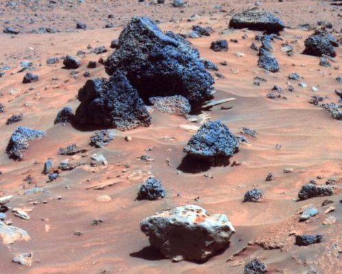 Spirit like Opportunity: a Martian "Iron Meteorite" is found... (1) - Sol 809
Caption originale:"The rock in the center foreground of this picture is suspected of being an Iron Meteorite. The PanCam on NASA's MER Spirit took this image during the Rover's 809th Sol (such as April 12, 2006). 
The foreground rock, informally named Allan Hills, and a similar rock called Zhong Shan, just out of the field of view to the left, have a smoother texture and lighter tone than other rocks in the area. 

The texture and glossiness of this pair reminded some members of the rover science team of a rock called Heat Shield Rock, which was observed by Opportunity, Spirit's twin, in the Meridiani Region of Mars more than a year ago. Examination of that rock's composition confirmed it to be an iron meteorite. 

Observations of Allan Hills and Zhong Shan with Spirit's Miniature Thermal Emission Spectrometer indicate that they are very reflective, like Heat Shield Rock. 
They are the first likely meteorites found by Spirit".
Parole chiave: Mars rocks, sand and debris - Boulder Field - Controversial