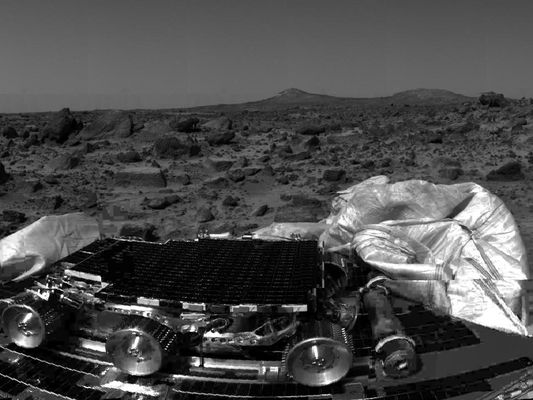 Panorama with Twin Peaks - Sol 3
Original caption:"Named Twin Peaks, the formation of two hills in the background are of extreme geological interest. The left hill has a smooth apron which may have been caused by gravitational processes or water. The hill on the right seems to have horizontal bands running through it. As of yet unidentified, the bands may be deposits, sedimentary layers, or terraces cut by erosion.
The Twin Peaks in the distance are approximately 1,6 Km from the Sagan Memorial Station. The rocks in the foreground are very diverse. Some are rounded and suggest transport by water, others are tabular and angular and indicate non-aqueous deposition. Preliminary hypotheses are that the angular rocks were thrown from ancient, nearby impact crater sites".
Parole chiave: Twin Peaks