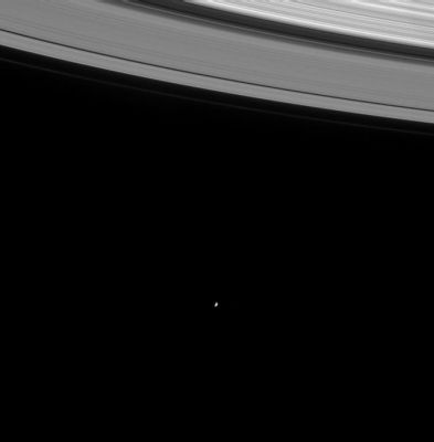 Saturn and Mimas
Caption NASA originale:"On its first orbit of the ringed planet, the Cassini spacecraft gazed into the distance to capture this image of the icy moon Mimas (398 Km - 247 miles wide). The faint F-Ring is visible as the outermost strand of the rings in this view. The image was taken in visible light with the narrow angle camera on August 16, 2004, at a distance of 8.9 MKm (5.5 MMs) from Saturn. The image scale is 53 kilometers (33 miles) per pixel. Contrast was slightly enhanced to aid visibility".
Parole chiave: Saturn and Company