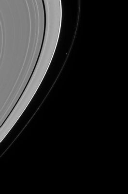 Saturn and Prometheus
Caption NASA originale:"Saturn's moon Prometheus is seen shepherding the inner edge of Saturn's "F-Ring". Prometheus is 102 Km across and was captured in a close-up view by the Cassini spacecraft near the time of orbital insertion at Saturn (see PIA06098). A number of clumps are visible here along the arcing "F-Ring". 
The image was taken with the Cassini spacecraft narrow angle camera on Aug. 5, 2004, at a distance of 8.2 MKM from Saturn through a filter sensitive to visible green light. The image scale is 49 Km per pixel. Contrast was slightly enhanced to aid visibility".
Parole chiave: Saturn and Company