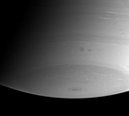 An "oval" storm near Saturn's South Pole
Caption NASA originale:"The region near Saturn's south pole shows a great deal of fascinating detail in this view from Cassini. Near upper right, an oval-shaped storm is bordered to the north and south by bright streaks of cloud, and two dark storms hover in a brighter cloud lane near the center. 
The image was taken with the Cassini spacecraft narrow angle camera on Aug. 7, 2004, at a distance of 8.4 million kilometers (5.2 million miles) from Saturn through a filter sensitive to wavelengths of infrared light. The image scale is 50 kilometers (31 miles) per pixel". 
Parole chiave: Saturn