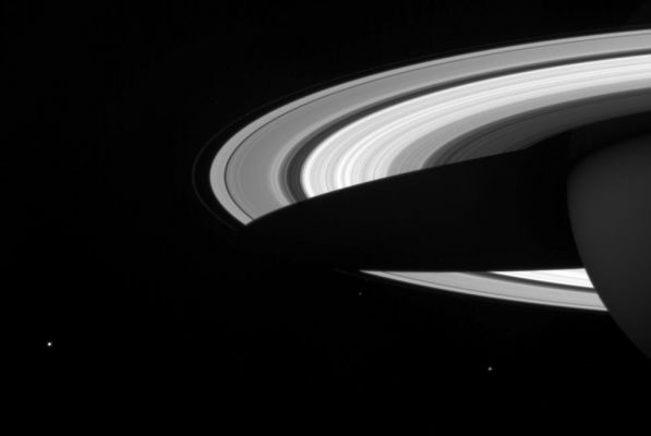 A "string" of Moons...
Captionn NASA originale:"A string of three of Saturn's icy moons encircles the planet in this Cassini image. 
Visible here are: Mimas, on near lower right; Janus just below the F-Ring and Enceladus on the lower left; the scene has been brightened to increase the moons' visibility. 
The image was taken in visible light with the Cassini spacecraft wide-angle camera on April 25, 2005, at a distance of approx. 2,4 MKM (about 1,5 MMs) from Saturn. The image scale is 141 Km (approx. 87 miles) per pixel".
Parole chiave: Saturn's Moons - Mimas, Janus and Enceladus