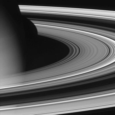 Saturn from 618.000 Km
Caption NASA originale:"Cassini pierced the ring plane and rounded Saturn on Oct. 27, 2004, capturing this view of the dark portion of the rings. A portion of the planet's atmosphere is visible here, as is its shadow on the surface of the rings. 
The image was taken with the Cassini spacecraft wide angle camera on Oct. 27, 2004, at a distance of about 618.000 Km from Saturn through a filter sensitive to wavelengths of infrared light centered at 1001 nanometers. The image scale is 33 Km per pixel".
