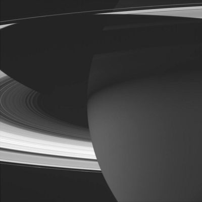 Saturn and the shadow of his Rings
This majestic view of Saturn captures several phenomena of interest to scientists working on the Cassini mission. The planet's nighttime atmosphere looms ahead - an excellent place to search for storms and lightning. Saturn's shadow stretches across the rings, which will over the next four years receive their most thorough examination since Galileo discovered them in 1610. And barely visible near lower right just inside the F-Ring, is the small shepherd moon Prometheus (102 Km across). Researchers will explore the many moons of Saturn, including special ones like Prometheus that help maintain some of the rings and gaps in this complex and dynamic system. 
The image was taken in visible light with the Cassini spacecraft wide angle camera on Oct. 29, 2004, at a distance of about 940.000 Km from Saturn. The image scale is 52 Km per pixel."
Parole chiave: Saturn's Rings