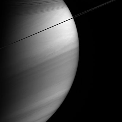 The Southern Side of Saturn
Caption NASA originale:"Viewed nearly edge-on, Saturn's rings appear dark and pencil-thin against the backdrop of the planet's swirling clouds. Notable here are the shadows cast by the rings onto the northern hemisphere, as well as details of the banded atmosphere, such as the bright equatorial region. The image was taken with the Cassini spacecraft wide-angle camera on Feb. 18, 2005, at a distance of approximately 1,2 MKM from Saturn through a filter sensitive to wavelengths of infrared light centered at 727 nnmts, where gaseous methane absorbs. The image scale is 67 Km per pixel".
Parole chiave: Saturn