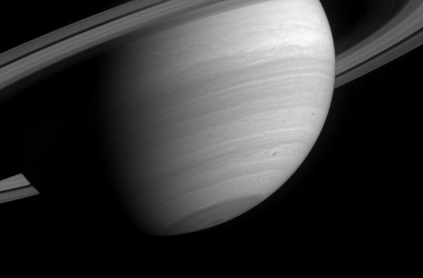 Sunlit South...
Caption NASA originale:"This poetic wide-angle camera view of Saturn reveals several small, dark storms in the southern latitudes, where storm activity has been prevalent since before Cassini arrived in orbit. 
Also notable here is the semi-transparent C-Ring, which is visible against the backdrop of the planet. 

The image was taken in visible light with the Cassini spacecraft wide-angle camera on April 23, 2005, through a filter sensitive to wavelengths of infrared light centered at 1028 nnmts and at a distance of approx. 2,4 MKM (about 1,5 MMs) from Saturn. The image scale is 142 Km (approx. 88 miles) per pixel".
Parole chiave: Saturn