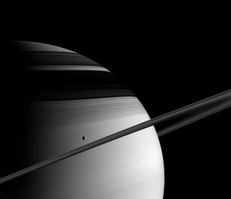 Saturn and Tethys
Caption NASA originale:"The majesty of Saturn overwhelms in this image from Cassini. Saturn's moon Tethys glides past in its orbit and the icy rings mask the frigid northern latitudes with their shadows. The image was taken in visible green light with the Cassini spacecraft wide-angle camera on June 10, 2005, at a distance of approx. 1,4 MKM (about 900.000 miles) from Saturn. The image scale is 80 Km (about 50 miles) per pixel".
Parole chiave: Saturn and Tethys