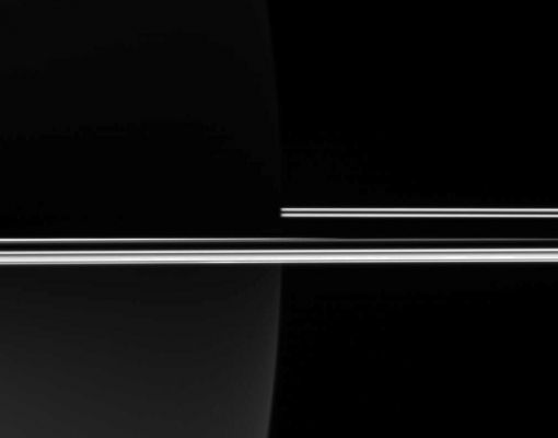 Dark Saturn, Bright Rings
Caption originale:"The Cassini spacecraft looked toward the darkened night side of Saturn to capture the eerie glow of the Rings, which, not being blocked by the Planet's bulk, remained brilliant in full Sunlight. 
The image was taken in visible light with the Cassini spacecraft wide-angle camera on Dec. 24, 2005, at a distance of approx. 286.000 Km (roughly 178.000 miles) from Saturn. 
The image scale is about 13 Km (approx. 8 miles) per pixel".
Parole chiave: Saturn