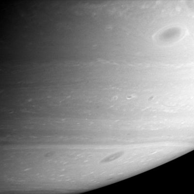 Restless Atmosphere (2)
Saturn's atmosphere comes alive with a multitude of dark vortices swirling through the Southern Hemisphere. 
Vortices are long-lived features that are part of the general circulation of Saturn's atmosphere. Vortices are thought to be caused by the shear between Eastward- and Westward-flowing jets - the alternating bands flowing past each other in the atmosphere. The vortices can last for months or years and probably grow by merging with other vortices until a few dominate a particular zone of wind shear between two jets. The vortex at upper right is one of the largest vortices on Saturn. 

The image was taken with the Cassini spacecraft narrow-angle camera on Feb. 16, 2006 at a distance of approximately 3,2 MKM (about 2 MMs) from Saturn. The image scale is about 19 Km (approx. 12 miles) per pixel.
Parole chiave: Saturn - Atmosphere - upper layers