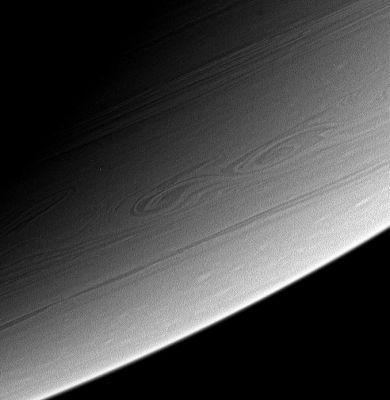 Saturn's Southern Restlesness
This view of high Southern Latitudes on Saturn shows very linear clouds at top, usually indicative of stable prevailing winds, and two turbulent, swirling features farther South. It is possible that these features merged some time after this image was taken. 

The image was taken with the Cassini spacecraft narrow-angle camera on March 6, 2006, using a filter sensitive to wavelengths of infrared light centered at 750 nnmts. The image was acquired at a distance of approximately 2,8 MKM (about 1,8 MMs) from Saturn. The image scale is approx. 16 Km (roughly 10 miles) per pixel.
Parole chiave: Saturn - Atmosphere - upper layers