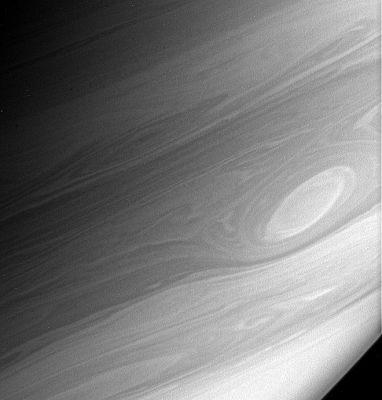 One "Eye" of Saturn!
Gaseous Saturn rotates quickly - once every approx. 10,8 hours - and its horizontal cloud bands rotate at different rates relative to each other. These conditions can cause turbulent features in the atmosphere to become greatly stretched and sheared, creating the beautiful patterns that the Cassini spacecraft observes. This turbulence and shear is particularly notable at those boundaries where the different bands slide past each other. 
Vortices like the one seen here are long-lived dynamical features that are part of the general circulation of Saturn's atmosphere. They are counterparts to the East-West flowing jets and can last for months or years. They probably grow by merging with other vortices until a few dominate a particular shear zone between two jets. 

This image was taken in polarized infrared light with the Cassini spacecraft narrow-angle camera on March 7, 2006, at a distance of approximately2,9 MKM (such as about 1,8 MMs) from Saturn. The image scale is 17 Km (about 10 miles) per pixel.
Parole chiave: Saturn - Atmosphere - upper layers