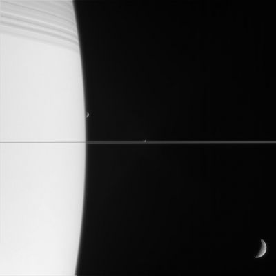 Crescent Moons (2)
Caption NASA originale:"Three of Saturn's moons are captured with the Planet in this exquisite family portrait. At top, Saturn is bedecked with the shadows of its innermost rings. 

Tethys appears at lower right, closest to Cassini. Janus (181 Km, or about 113 miles across) and Mimas (397 Km, or about 247 miles across) are on the far side of the immense Ringed Planet. 
Mimas is just about to slip behind Saturn. 

The image was taken in visible light with the Cassini spacecraft narrow-angle camera on March 13, 2006, at a distance of approx. 2,7 MKM (such as about 1,6 MMs) from Saturn. The image scale is about 17 Km (approx. 11 miles) per pixel on Janus and Mimas, and 14 about Km (such as about 9 miles) per pixel on Tethys".
Parole chiave: Saturn and Companions
