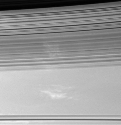 Clouds of Saturn
Caption NASA originale:"The soft, sweeping shadows of Saturn's C-Ring cover bright patches of clouds in the Planet's Atmosphere. The shadow-throwing rings stretch across the view at bottom. 
The dark inner edge of the B-Ring is visible at top. 

The image was taken using a spectral filter sensitive to wavelengths of infrared light centered at 752 nanometers. The image was acquired with the Cassini spacecraft wide-angle camera on April 28, 2006 at a distance of approximately 340.000 Km (about 211,000 miles) from Saturn. Image scale is roughly 17 Km (about 10 miles) per pixel".
Parole chiave: Saturn - Atmosphere - upper layers