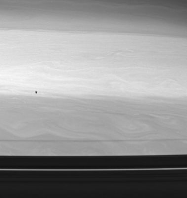 A shadow's over Saturn!
Caption NASA originale:"The shadow of Epimetheus, one of Saturn's co-orbital moons, races across the Planet's restless cloud tops. Epimetheus cruises along beyond the orbits of the narrow F-Ring and its shepherd moons. 
Farther south on Saturn, the swirls and eddies are obscured by the shadow of the outer A-Ring and its two prominent, moon-containing gaps, Encke (bottom) and Keeler (dim, at the A-Ring edge). 
The image was taken with the Cassini spacecraft wide-angle camera using a spectral filter sensitive to wavelengths of infrared light centered at 728 nnmts. The view was obtained on June 30, 2006, from a distance of approximately 335.000 Km (about 208.000 miles) from Saturn. 
Image scale is approx. 16 Km (a little less than 10 miles) per pixel".
Parole chiave: Saturn - Upper Atmosphere