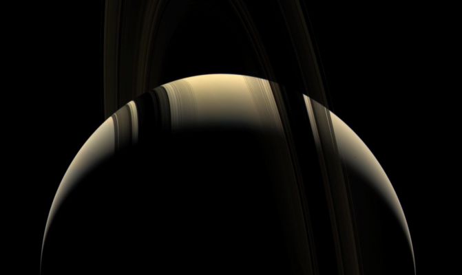 The "Ringed Beauty" in natural colors
Caption NASA originale:"This moody true color portrait of Saturn shows a world that can, at times, seem as serene and peaceful as it is frigid and hostile. Saturn's unlit-side Rings embrace the Planet while their shadows caress the Northern Hemisphere. 
The view was obtained from about 15° above the Ring-Plane as Cassini continued its climb to higher orbital inclinations. 

Images taken using red, green and blue spectral filters were combined to create this natural color view. The image was acquired with the Cassini spacecraft wide-angle camera on Aug. 18, 2006 at a distance of approximately 1,3 MKM (such as about 800.000 miles) from Saturn and at a Sun-Saturn-spacecraft, or phase, angle of 137°. 
Image scale is roughly 76 Km (about 47 miles) per pixel".
Parole chiave: Saturn
