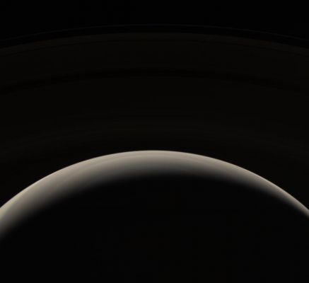 Saturn's limb (NASA - natural colors)
Caption NASA originale:"From its unique perspective high above the Planet, the Cassini spacecraft looks down upon Saturn's murky Northern Hemisphere. The bluish hues seen in some Cassini views of Saturn's North are notably absent in this viewing geometry. 
The dark side of Saturn's extensive Rings is just visible in the top half of the image. 
The view looks toward the unlit side of the Rings, from about 44° above the Ring-Plane. 
Images taken using red, green and blue spectral filters were combined to create this natural color view. 

The images was taken with the Cassini spacecraft wide-angle camera on Oct. 30, 2006, at a distance of approx. 1,4 MKM (about 900.000 miles) from Saturn and at a Sun-Saturn-spacecraft, or phase, angle of 150°. Image scale is roughly 78 Km (about 49 miles) per pixel".
Parole chiave: Saturn