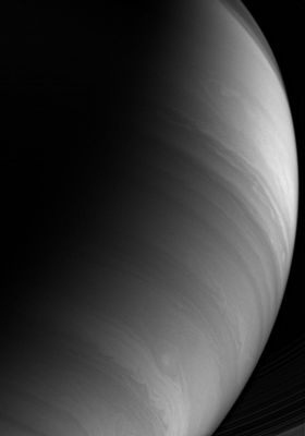 Clouds & Clouds
Caption NASA:"Bright equatorial clouds give way to darker southern bands in this infrared Cassini spacecraft view taken with a filter sensitive to methane absorption in Saturn's Atmosphere. 
Delicate shadows cast onto the Planet by its Inner Rings are visible at upper right. 
A portion of the same Inner Rings are seen at lower right. 

The image was taken with the Cassini spacecraft wide-angle camera using a combination of spectral filters sensitive to wavelengths of polarized infrared light. 
The view was acquired on Jan. 14, 2007 at a distance of approx. 976.000 Km (about 606.000 miles) from Saturn. 
Image scale is roughly 55 Km (about 34 miles) per pixel".
Parole chiave: Saturn - Upper Atmosphere