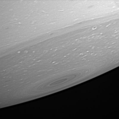 The South-Pole of Saturn
Caption NASA originale:"Cassini peeks at Saturn's relatively dark South Pole, providing an up-close look at the haze-free upper atmosphere there. The banded structure around the pole seems to be superimposed on the characteristic high-latitude, mottled, turbulent structure (the white puffs of cloud near the Pole), suggesting that the banding is a shallow, not deep, feature. 

The image was taken in visible light with the Cassini spacecraft narrow-angle camera on April 23, 2005, through a filter sensitive to wavelengths of polarized infrared light at a distance of approx. 2,4 MKM (about 1,5 MMs) from Saturn. The image scale is 14 Km (approx. 9 miles) per pixel".
Parole chiave: Saturn