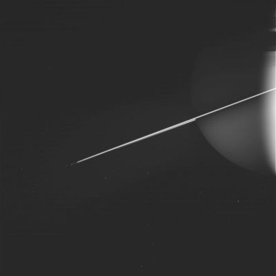 Saturn and some of His Moons
How thin are the Rings of Saturn? Brightness measurements from different angles have shown Saturn's rings to be about 1 Km thick, making them many times thinner, in relative proportion, than a razor blade. This thinness sometimes appears in dramatic fashion during an image taken nearly along the Ring-Plane. The Cassini spacecraft now orbiting Saturn has captured another shot that dramatically highlights the Ring's thinness. The above artistic looking image was taken early last month in infrared polarized light. If alone in space, the unlit part of Saturn would be much darker. Reflection of light off of moons (...) and the billions of small particles in Saturn's Rings, however, gives the giant space orb an unusual glow, an effect highlighted in polarized light.

W00012439.jpg was taken on December 17, 2005 and received on Earth December 18, 2005. The camera was pointing toward PROMETHEUS from a distance of approximately 2.830.065 Km.
The image was taken using the CL1 and CL2 filters.
Parole chiave: Saturn and Companions