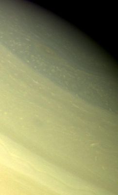 Saturn's Clouds from Voyager 2
Caption NASA originale:"A vortex, or large atmospheric storm, is visible at 74` north latitude in this color composite of Voyager 2 Saturn images obtained on Aug. 25, 1980, from a range of about 1.000.000 Km.  This particular storm system seems to be one of the few large-scale structures in Saturn's polar region, which otherwise is dominated by much smaller-scale features suggesting convection. The darker, bluish structure (upper right) oriented east to west strongly suggests the presence of a jet stream at these high latitudes". 
Parole chiave: Saturn