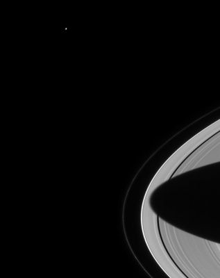 Lonely Mimas...
Caption NASA originale:"Mimas swings around Saturn, seeming to gaze down at the planet's splendid rings. The outermost, narrow F ring is visible here and exhibits some clumpy structure near the bottom of the frame. The shadow of Saturn's southern hemisphere stretches almost entirely across the rings. Mimas is 398 Km (247 miles) wide. 
The image was taken with the Cassini spacecraft narrow angle camera on August 15, 2004, at a distance of 8,8 MKM (5.5 million miles) from Saturn".
Parole chiave: Saturn and Company