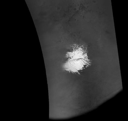 The South Pole of Mars (Original NASA/MGS/MSSS b/ Frame)
On 8 September 2005 (UT), the MGS-MOC resumed imaging of Mars after a nearly 2-week hiatus to recover the spacecraft from a glitch that put MGS into a protective "safe mode". The MOC was turned on during MGS orbit 29053, while the spacecraft was flying across day side of the Planet. MOC then resumed taking pictures on the next orbit. Shown here is a portion of the first picture acquired following MOC turn-on. The image shows a view of the Martian South Polar Region, as it appeared on September 8, 2005. The image was taken by MOC's red wide angle camera. In this case, the spacecraft began imaging Mars as it passed across the southern terminator, at the bottom of the image. MGS then flew southward, over the Polar Cap, then northward toward the Equator. The Equatorial Region is further north than the area shown here. The equatorial region is further north than the area shown here. The image not only provided the MOC team a confirmation that MOC imaging has resumed, this particular image, in the map-projected form shown here, is being used by the team to assist in setting the exposures for MOC narrow angle camera images that will be acquired from the south polar region over the next several days.
Parole chiave: Mars from orbit - South Pole